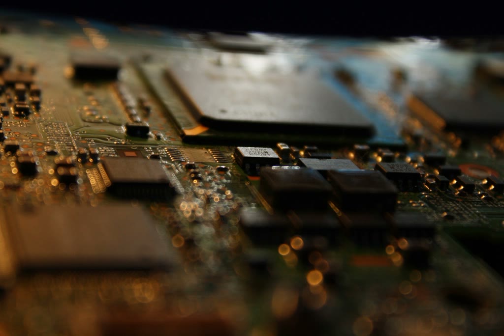 Close-up of a circuit board representing the compute and systems AI agents run on